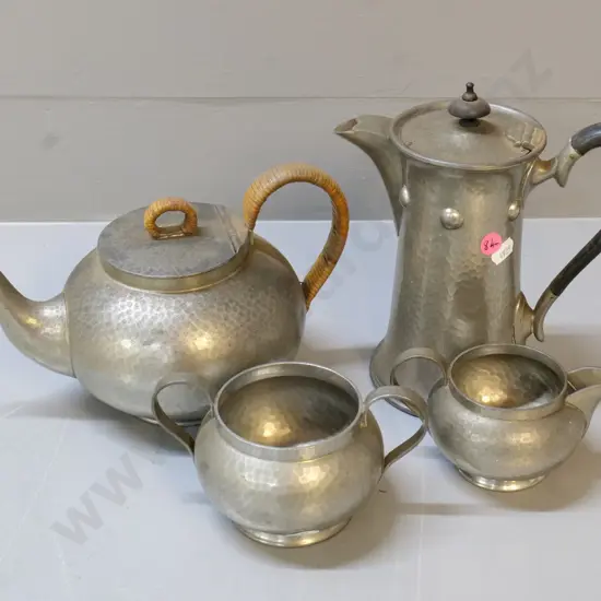 4 pieces of Don hand-beaten English pewter - 3 piece tea set with cane handle & a coffee pot with bakelite handle H210
