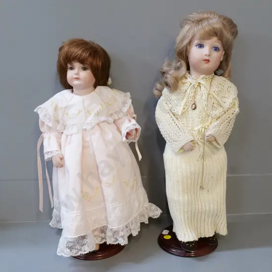 2 porcelan display dolls with stands - taller with cameo necklace is H-430