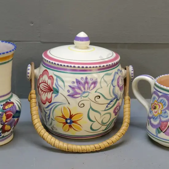 3 pieces of Poole hand-painted pottery - biscuit barrel, jug, and vase H-140