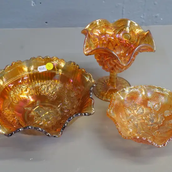 3 pieces marigold carnival glass - small comport and 2 bowls, larger with windmill design D-200