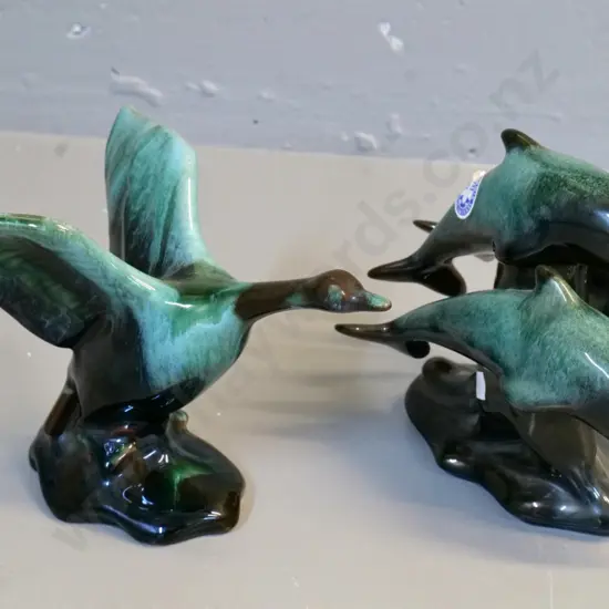2 Blue Mountain animal figures - goose taking off and a trio of leaping dolphins - both approx H-160