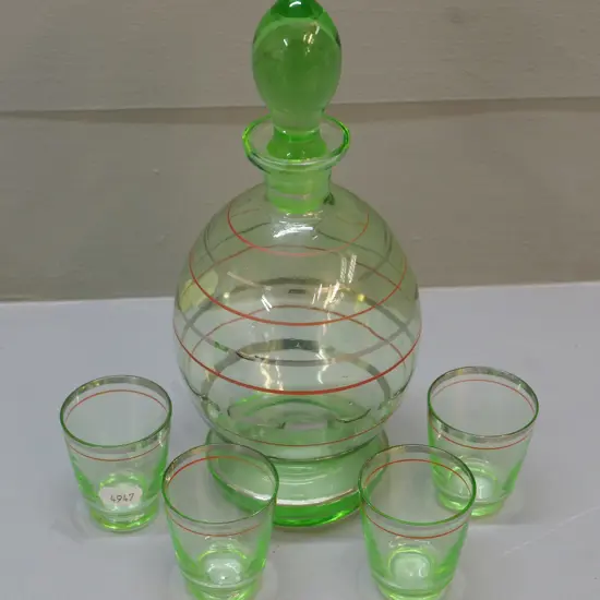 small green uranium glass with gilt trim stoppered decanter H-230 and 4 nip glasses