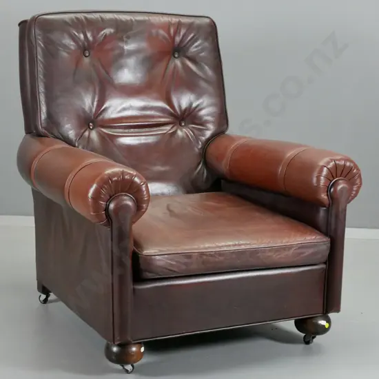 leather upholstered club chair with ball front feet and casters, chestnut brown colour leather H910 W830 D860