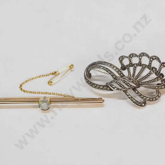 9ct bar brooch with light blue stone & a marcasite brooch