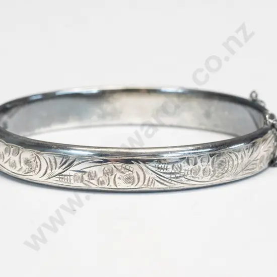 silver bangle with safety chain
