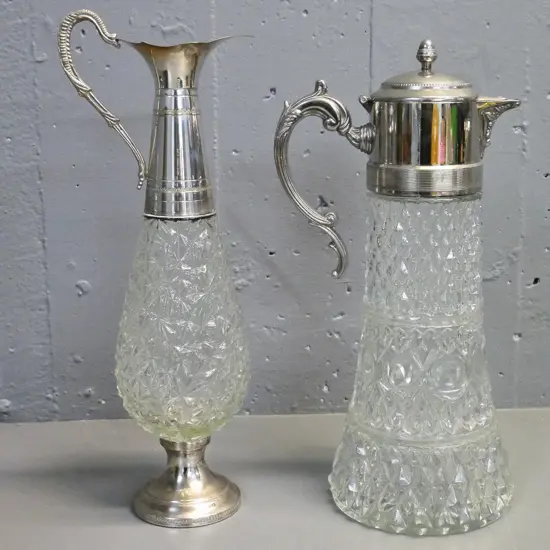 2 depression glass and silver plated claret jugs - one with hinged lid H-380, other is missing its stopper