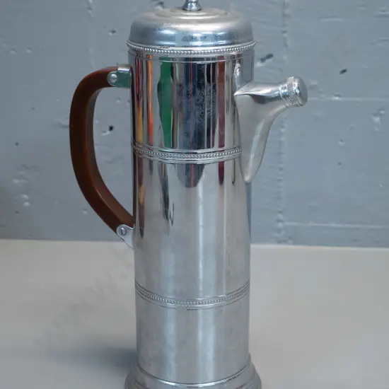 tall plated coffee pot with bakelite handle, spout has stopper jammed. Marked Kromecraft - Farber Bros New York H320