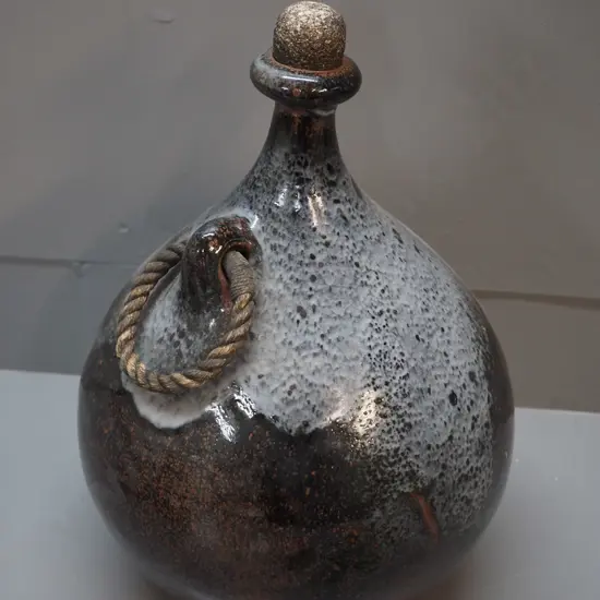 studio pottery large flask with cork stopper, rope handle, "LE" maker's mark on base H380 D270