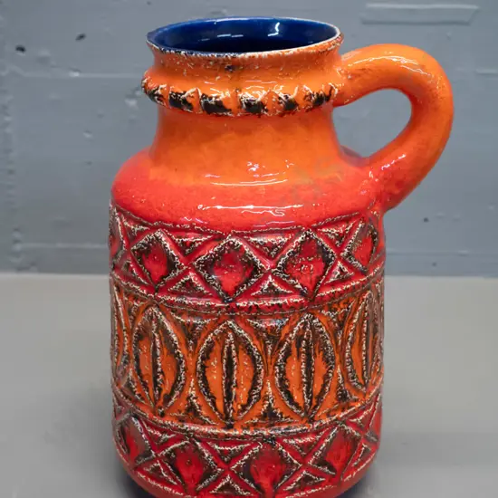 German pottery handled vase - relief pattern orange outer, cobalt blue interior H250