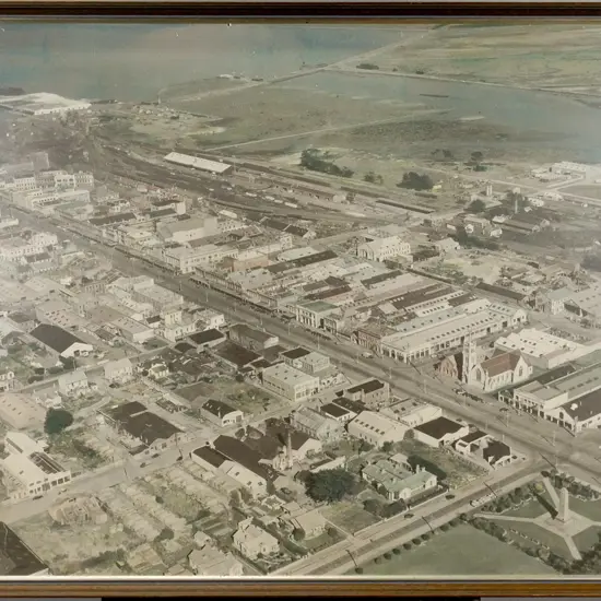 framed Whites Aviation? hand coloured photograph - Invercargill H-650 W-920 (slight age damage)