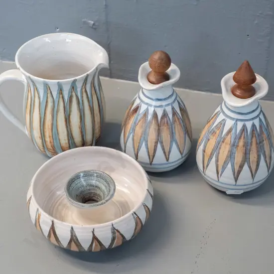 4 pieces Hanmer New Zealand pottery - 2 stoppered sauce bottles, jug H-120 and candlestick