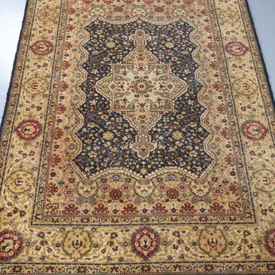 Persian style machine woven wool floor rug - black red and golds L1950 W1410