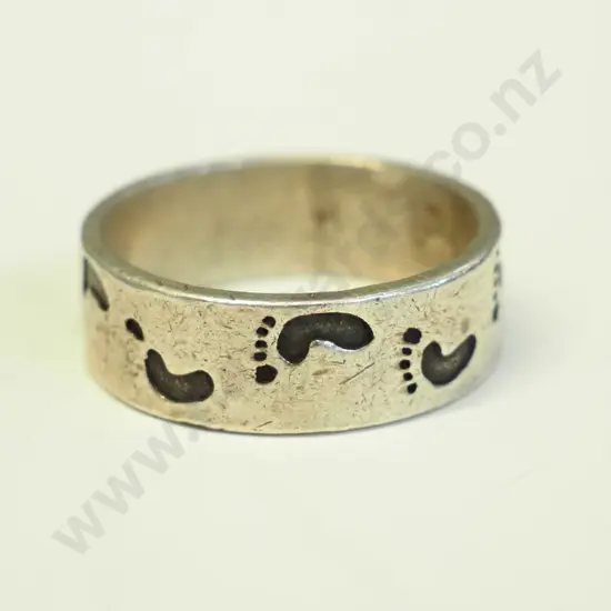 silver ring with paw prints