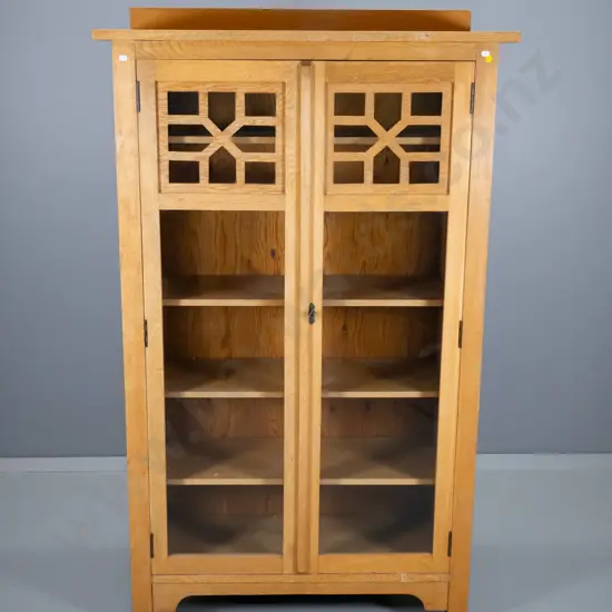 deco light oak bookcase, 2 lockable glazed doors w/fretted detail, Nees Dunedin label H1510 W910 D360
